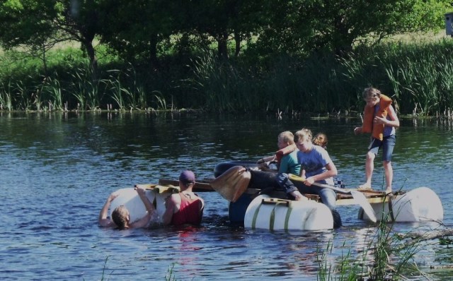 Peter and Luke fix the raft.