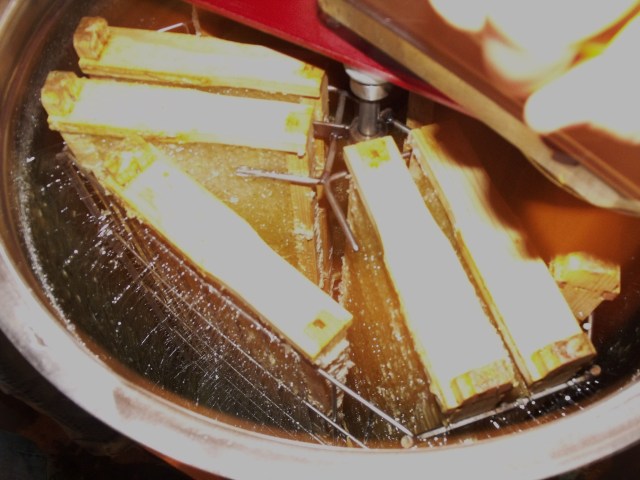 See the honey being forced out of the frames as they spin.