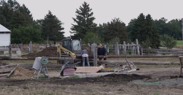 Caleb and Fred putting in a new fence to replace the old fence that is now part of Peter and Frenchy's basement.