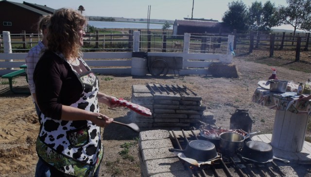 Me demonstrating cooking pizza in a dutch oven for fun at J Heart Ranch Days, Waubay, SD