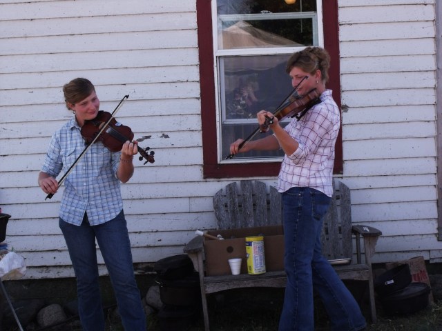 Twins fiddle near our cooking area.