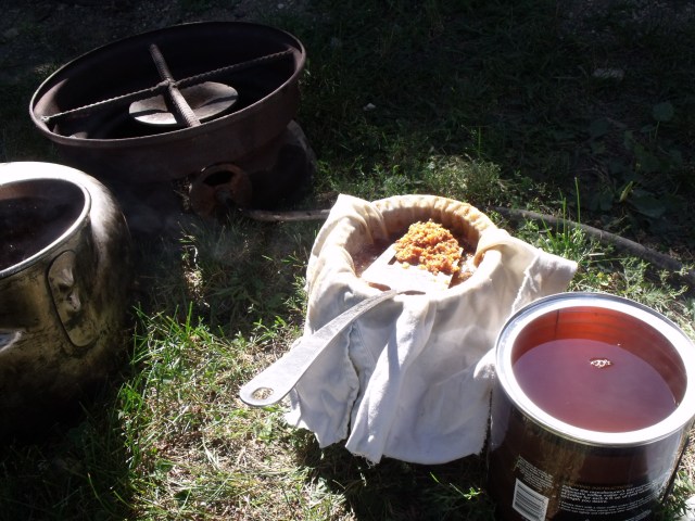 Rendered down 6 large coffee cans of lard for winter use out on a gas cooker.