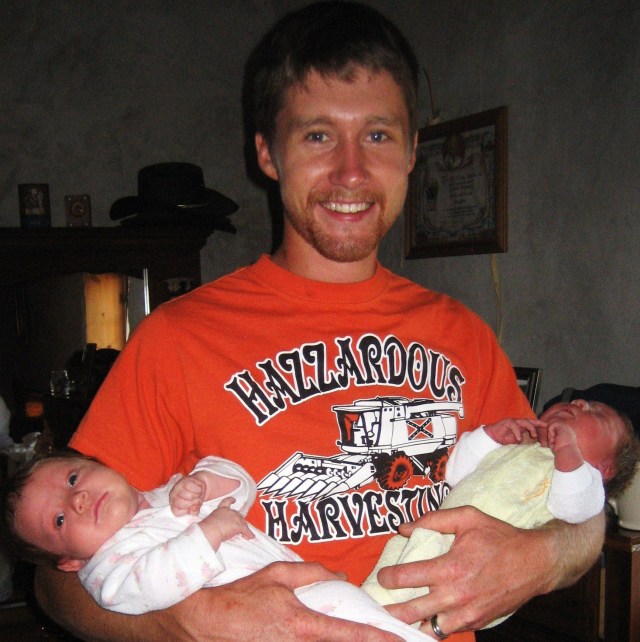 Luke holding both of the water babies.