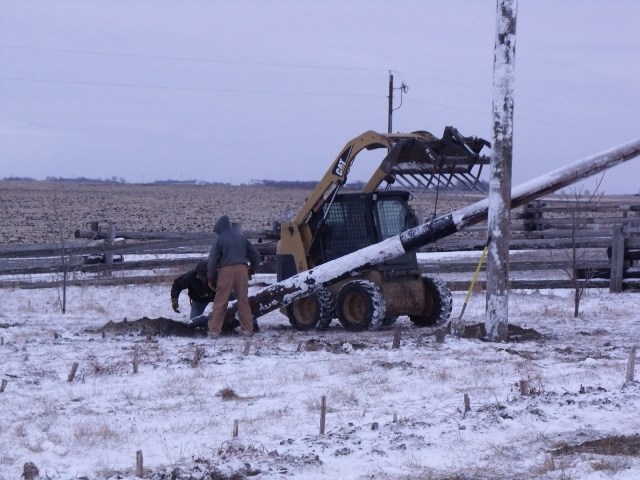 Fred moves in the Utility poles, then Clayton and Caleb plant it.