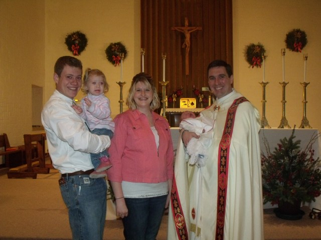 Peter, Kallie Jo, Frenchy, Fr. Craig Timmerman and Blase Weston Ryland at his baptism.