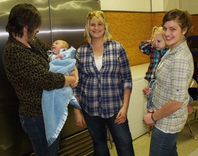 JoAnn Kruse, Blase Ryland, Francesca Ryland, Maggie holding little Kallie Jo Ryland.