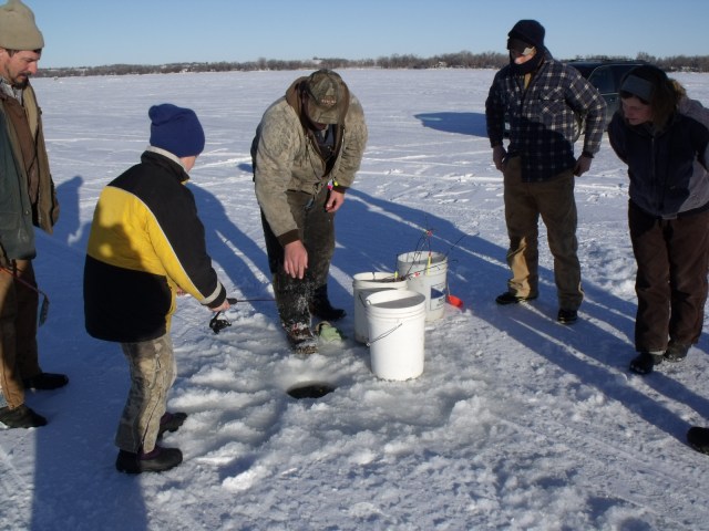 Mario listens to Don as he prepares to start fishing.