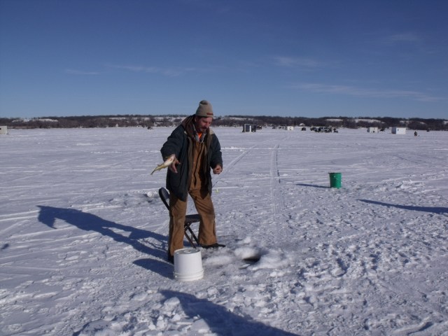 Fred tosses a fresh catch to be chilled on ice very rapidly.  Our luck had just picked up.