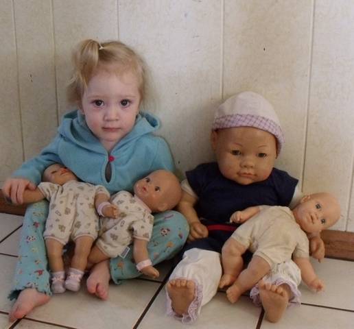 Kallie Jo with Bella's baby doll collection.  Too cute.........