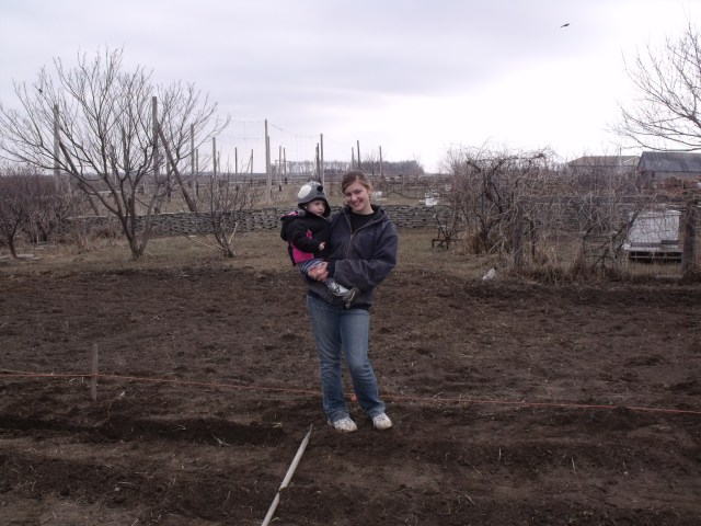 Kallie Jo snuck down while her parents were planting their taters.  She helped knock over posts and bale twine and pull up the seed:)