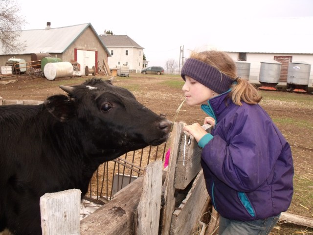 Isabella Angel goofing off with a steer.