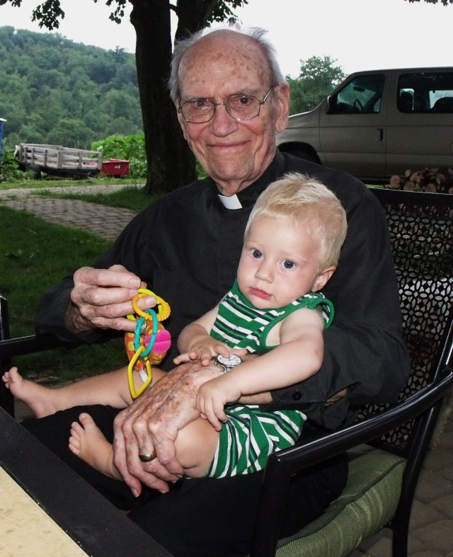 Peter's grandfather, Fr. Ray Ryland with Blase, one of his three great-granchildren.  A nice visit!