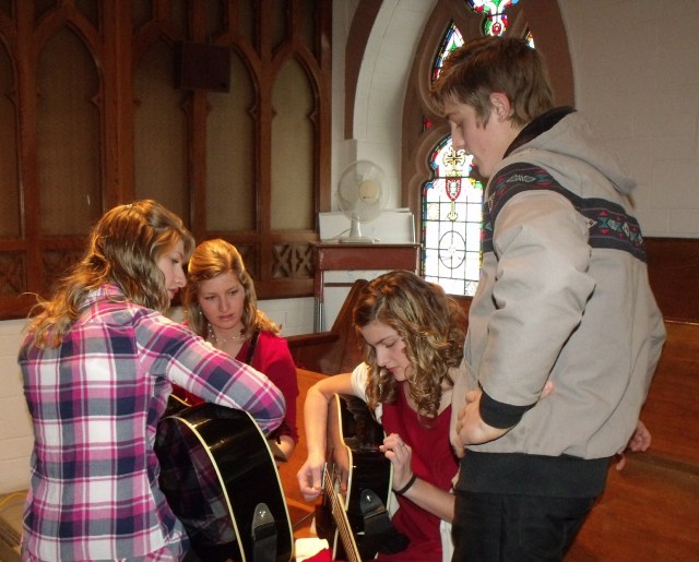Tuning up for Silent Night at mass.