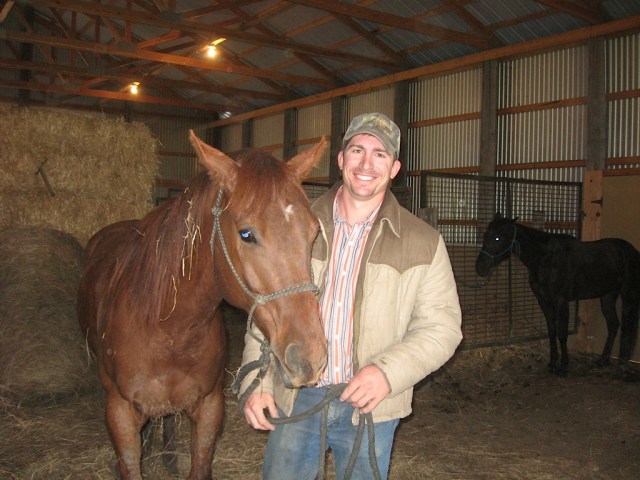 Clayton in his horse barn.
