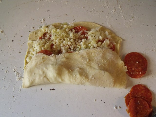 Stromboli! Dough, onions, pepperoni or sausage, garlic, olive oil, oregano......bake and devour! Dip in marinara sauce.