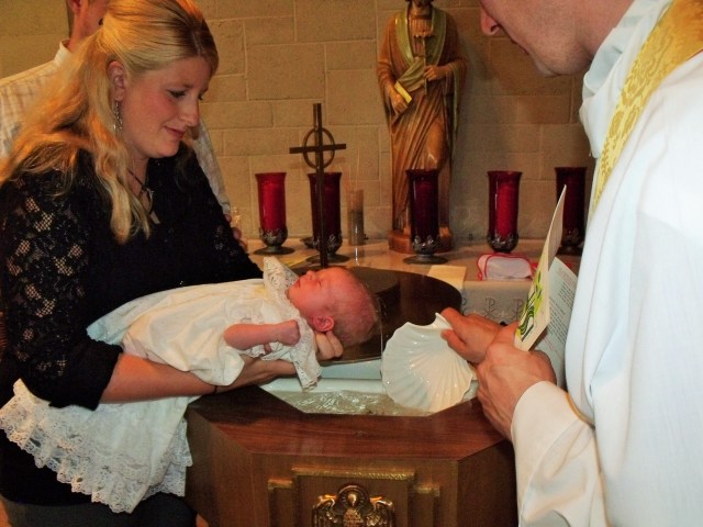 Josie June Ryland baptized at St. Leo.