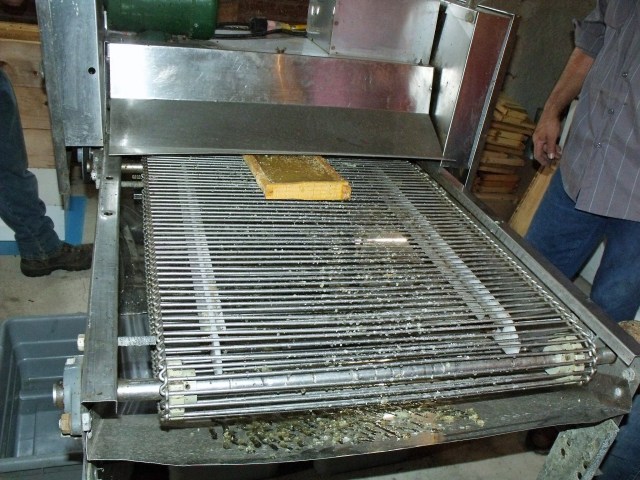 The frame comes out the opposite site with the caps removed.