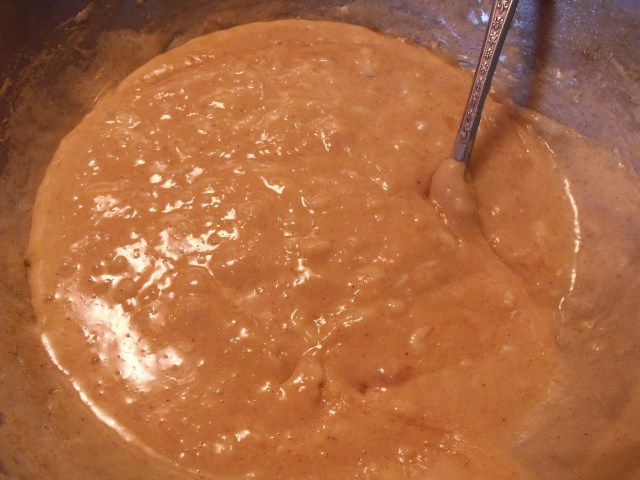 Mixing the cheese in a pan.