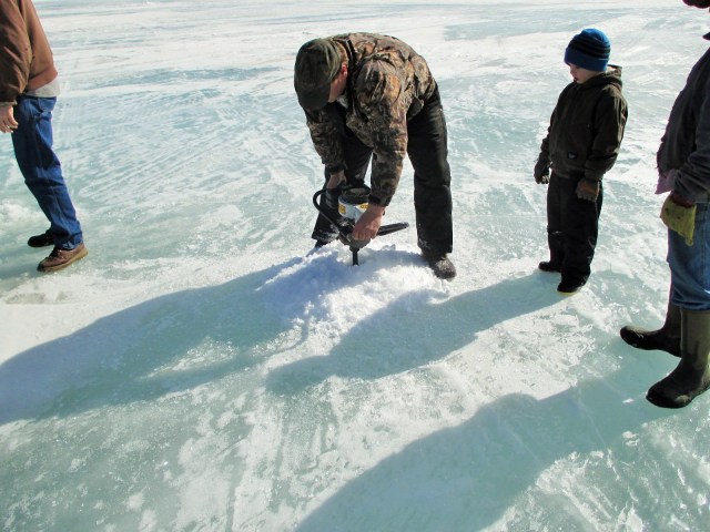 Don digging our fishing holes in 32 inch thick ice!
