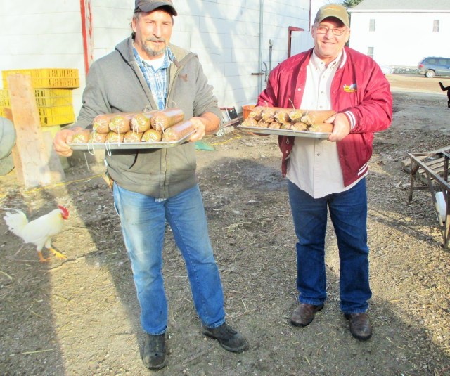 Fred and Alan carrying out a load of sausages to be cooked in the smoker.
