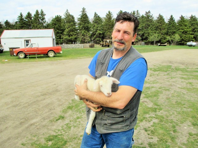 My shepherd husband Fred with a bottle lamb.