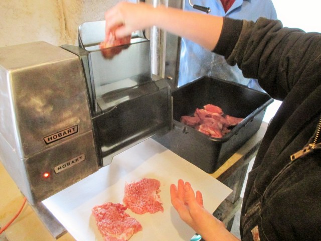 Marisa trying out the new Hobart Meat Tenderizer with Alan talking her through it all.