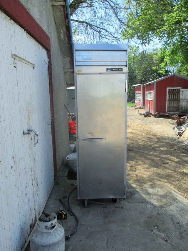 Gas fired smoke house made from a broken refrigerator. 