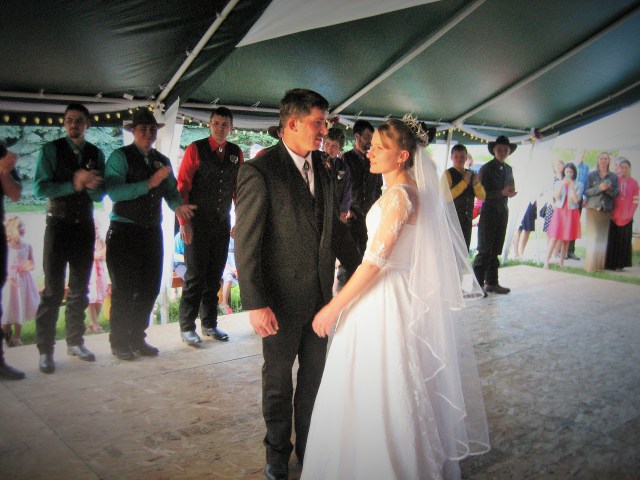Outdoor dance floor right next to the church hall. Clayton and his beautiful bride, Angelica!